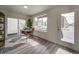 Bright home office features large window and sliding glass door at 12940 E 103Rd Ave, Commerce City, CO 80022