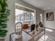 Sunlit home office boasts a desk and window views of neighborhood at 12940 E 103Rd Ave, Commerce City, CO 80022
