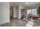 Bright home office features built-in shelving and sliding glass doors at 12940 E 103Rd Ave, Commerce City, CO 80022