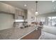 Modern kitchen with granite countertops and island at 12940 E 103Rd Ave, Commerce City, CO 80022