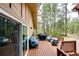 Outdoor deck featuring comfortable seating and a grill, perfect for entertaining at 8788 E Tanglewood Rd, Franktown, CO 80116
