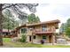 Back exterior view with wood deck and hot tub and room for outdoor enjoyment and relaxation at 8788 E Tanglewood Rd, Franktown, CO 80116