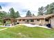 Scenic backyard with a pergola, patio, and ample green space, ideal for outdoor gatherings and relaxation at 8788 E Tanglewood Rd, Franktown, CO 80116