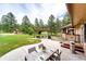 Expansive backyard featuring a patio, pergola, and a playground, perfect for entertaining and outdoor activities at 8788 E Tanglewood Rd, Franktown, CO 80116