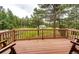 Enjoy views from this spacious outdoor deck, perfect for relaxing or entertaining in a wooded setting at 8788 E Tanglewood Rd, Franktown, CO 80116