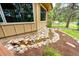 Exterior view highlighting a creek flowing by the house at 8788 E Tanglewood Rd, Franktown, CO 80116