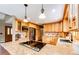 Well-appointed kitchen featuring granite countertops, stainless steel appliances, and custom wood cabinetry at 8788 E Tanglewood Rd, Franktown, CO 80116