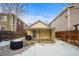 Fenced backyard with patio and covered structure at 4234 N Raleigh St, Denver, CO 80212