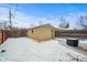 Detached garage and expansive backyard with snow at 4234 N Raleigh St, Denver, CO 80212