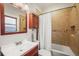 Clean bathroom with shower/tub combo and updated vanity at 4234 N Raleigh St, Denver, CO 80212