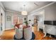 Charming dining area with a round table, four chairs, and hardwood floors at 4234 N Raleigh St, Denver, CO 80212