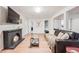 Finished basement featuring a brick fireplace, open layout, and comfortable seating area at 1742 S Alcott St, Denver, CO 80219