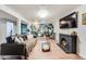 Finished basement featuring a fireplace, hardwood style floors, and geometric wall decor at 1742 S Alcott St, Denver, CO 80219