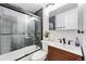 Bathroom featuring a modern vanity, sleek glass shower, and contemporary fixtures at 1742 S Alcott St, Denver, CO 80219