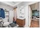 Stylish bathroom with modern vanity, decorative mirror, and shower at 1742 S Alcott St, Denver, CO 80219