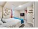 Well-lit bedroom with cozy carpet and decor, ready for relaxation at 1742 S Alcott St, Denver, CO 80219
