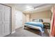 Comfortable bedroom with neutral carpet, closet, and bedside table at 1742 S Alcott St, Denver, CO 80219