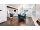 Dining room features hardwood floors, modern lighting, and an open concept leading to the kitchen at 1742 S Alcott St, Denver, CO 80219