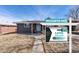 Charming home featuring solar panels, a welcoming front porch, and professional real estate signage at 1742 S Alcott St, Denver, CO 80219