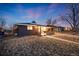 Charming home showcasing a covered porch, solar panels, and well-maintained landscaping at 1742 S Alcott St, Denver, CO 80219