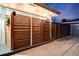 A modern horizontal wood fence defines the property line and adds privacy at 1742 S Alcott St, Denver, CO 80219