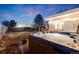 This backyard boasts a hot tub, patio, and ample yard space with privacy fence at 1742 S Alcott St, Denver, CO 80219