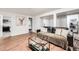 Inviting living room with wood floors, modern decor, and stylish furniture at 1742 S Alcott St, Denver, CO 80219