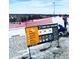 Image of the Ruby Hill Rail Yard ski terrain park including signage, obstacles, and skiers/snowboarders at 1742 S Alcott St, Denver, CO 80219