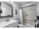 Clean bathroom with white vanity, shower, and modern fixtures at 1563 E 131St Pl, Thornton, CO 80241