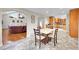 Eat-in kitchen with herringbone tile floors and wood cabinets at 9128 Hillview Rd, Morrison, CO 80465