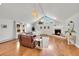 Bright living room with hardwood floors, fireplace, and vaulted ceiling at 9128 Hillview Rd, Morrison, CO 80465