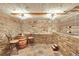 Elegant wine cellar with stone walls and a tasting area at 9128 Hillview Rd, Morrison, CO 80465