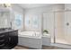 Spa-like bathroom with soaking tub and walk-in shower at 3386 Ulster St, Denver, CO 80238