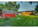 Backyard view of house and shed at dusk at 3701 W Greenwood Pl, Denver, CO 80236