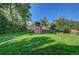 Large backyard with shed and grassy area at 3701 W Greenwood Pl, Denver, CO 80236