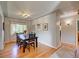 Elegant dining room with hardwood floors and a view to backyard at 3701 W Greenwood Pl, Denver, CO 80236