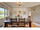 Dining room features hardwood floors and view of backyard at 3701 W Greenwood Pl, Denver, CO 80236