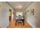 Bright dining room with hardwood floors and large windows at 3701 W Greenwood Pl, Denver, CO 80236