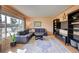 Cozy living room with sectional sofa and built-in shelving at 3701 W Greenwood Pl, Denver, CO 80236