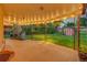 Evening view of backyard patio with fireplace at 3701 W Greenwood Pl, Denver, CO 80236