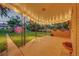 Covered patio with string lights and planters at 3701 W Greenwood Pl, Denver, CO 80236