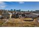 Expansive home with meticulously landscaped yard, outbuildings and city views in the background at 6302 Charrington Dr, Cherry Hills Village, CO 80111
