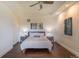 Serene bedroom with hardwood floors, neutral tones, and soft lighting at 6302 Charrington Dr, Cherry Hills Village, CO 80111