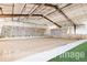 Spacious indoor climbing gym, featuring diverse climbing holds and artificial turf flooring at 6302 Charrington Dr, Cherry Hills Village, CO 80111