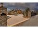 Front exterior showcasing paved driveway, fountain, stone entryway and meticulously maintained landscaping at 6302 Charrington Dr, Cherry Hills Village, CO 80111