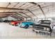 Large garage filled with an impressive collection of classic cars in a spacious setting at 6302 Charrington Dr, Cherry Hills Village, CO 80111