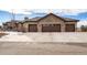 Spacious three-car garage with brown doors and stone accents on a home's exterior at 6302 Charrington Dr, Cherry Hills Village, CO 80111