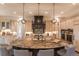 Spacious kitchen features custom cabinetry, granite countertops, and modern lighting fixtures at 6302 Charrington Dr, Cherry Hills Village, CO 80111