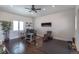 Spacious office featuring hardwood floors, large windows, ceiling fan, and comfortable seating at 6302 Charrington Dr, Cherry Hills Village, CO 80111