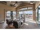 Relaxing outdoor patio with comfortable seating, ceiling fan, and scenic views at 6302 Charrington Dr, Cherry Hills Village, CO 80111